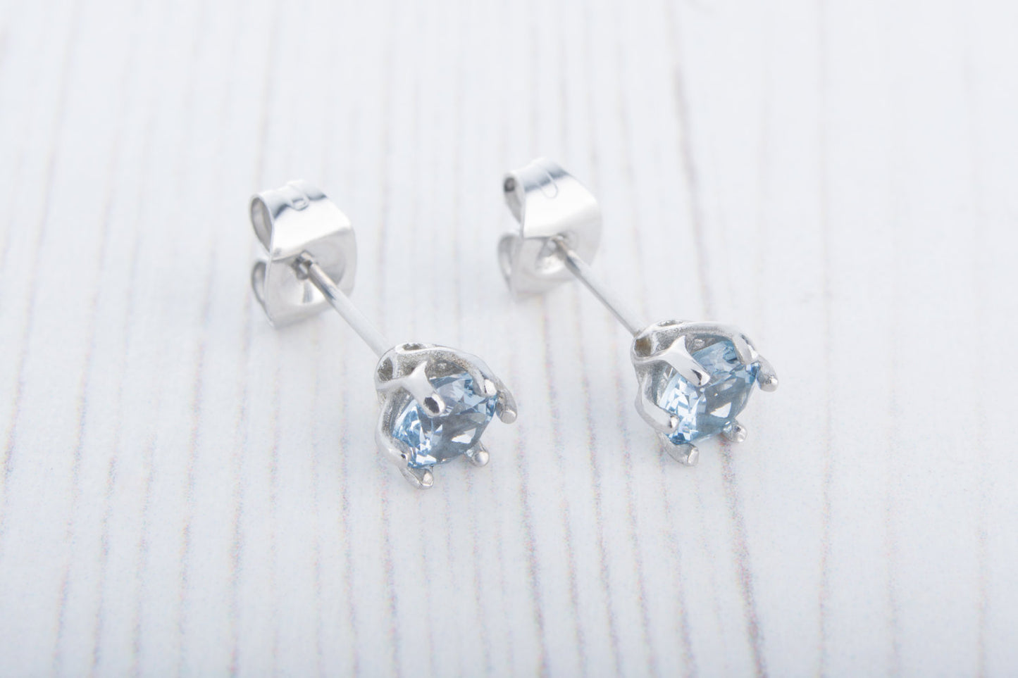 Natural Aquamarine stud earrings, available in titanium, white gold and surgical steel 4mm or 5mm sizes