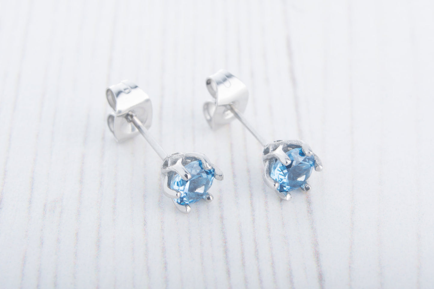 Genuine Blue Topaz stud earrings, available in titanium, white gold and surgical steel 4mm, 5mm, 6mm sizes