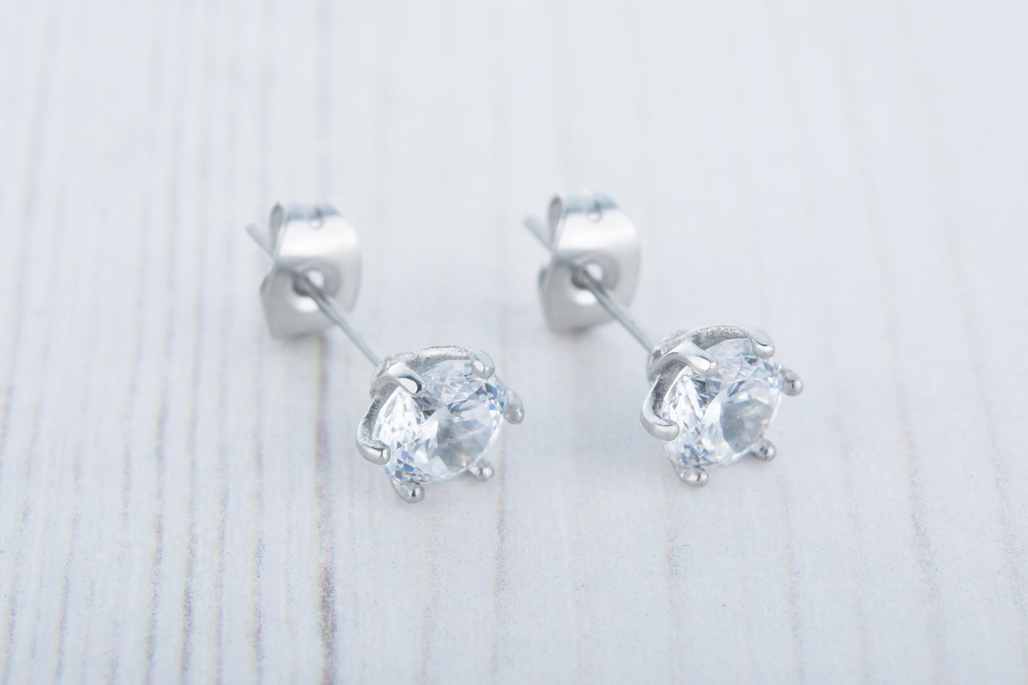 Portuguese Cut Man Made Diamond Simulant stud earrings, available in titanium, white gold and surgical steel 5mm or 6mm sizes