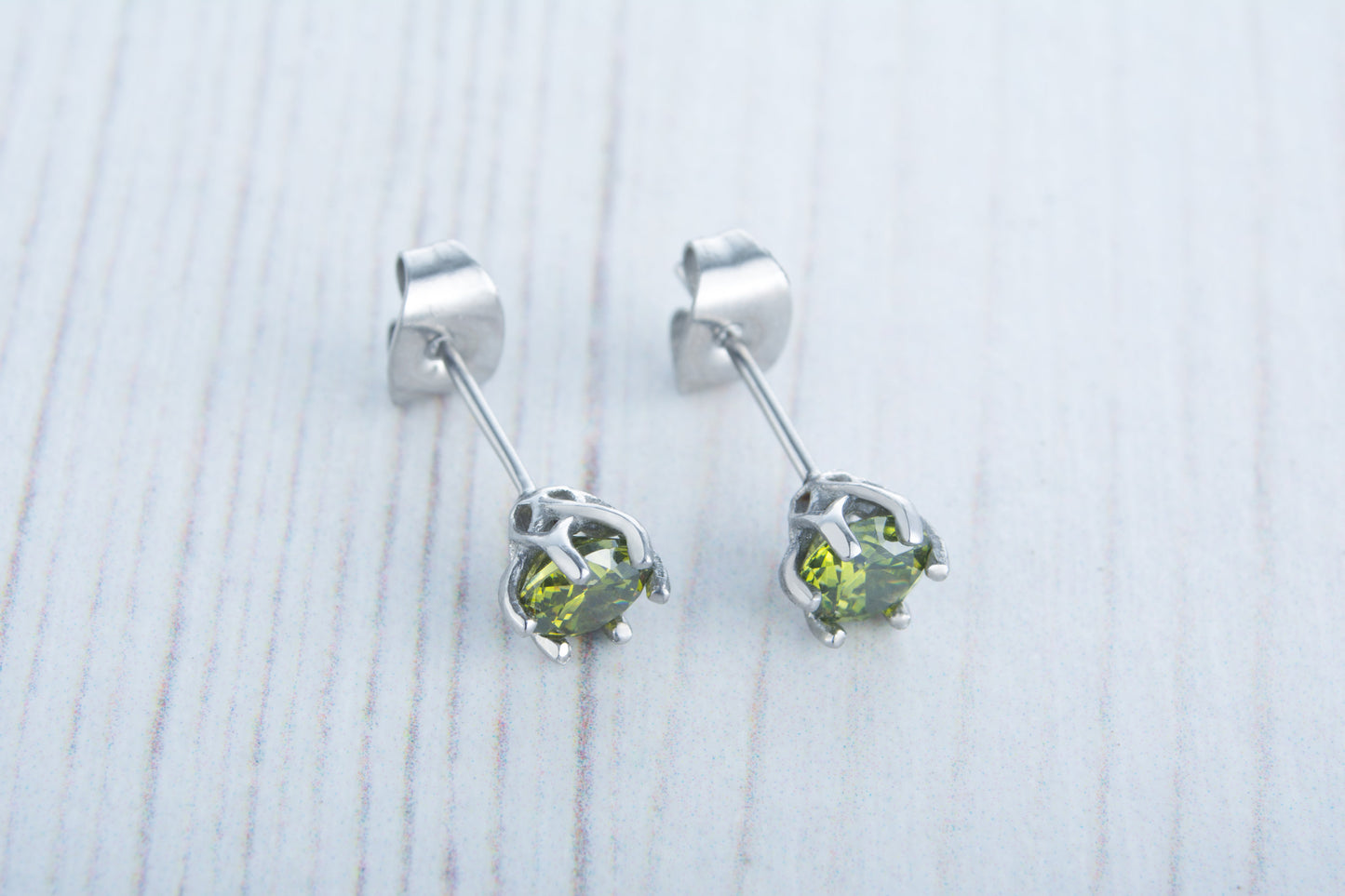 Natural Peridot stud earrings, available in titanium, white gold and surgical steel 4mm, 5mm and 6mm sizes