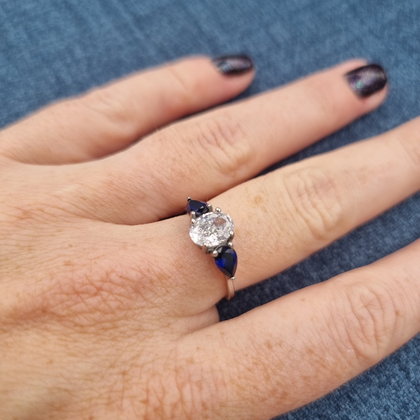 Lab blue sapphire and White Genuine moissanite Oval & pear cut 3 stone Trilogy Ring in White Gold or Titanium