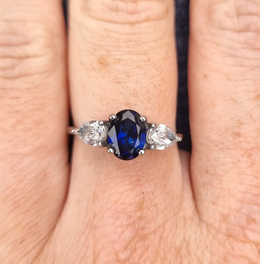 Blue Sapphire and White Genuine moissanite Oval & pear cut 3 stone Trilogy Ring in White Gold or Titanium  - engagement ring - handmade ring