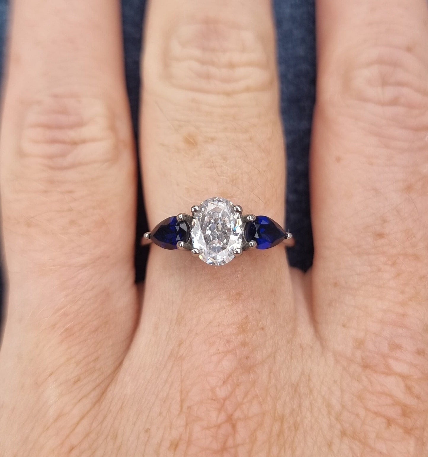 Lab blue sapphire and White Genuine moissanite Oval & pear cut 3 stone Trilogy Ring in White Gold or Titanium