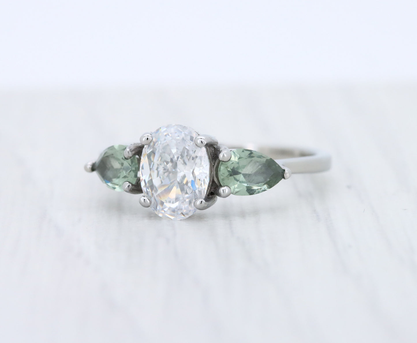 Green Sapphire and White Genuine moissanite Oval & pear cut 3 stone Trilogy Ring in White Gold or Titanium