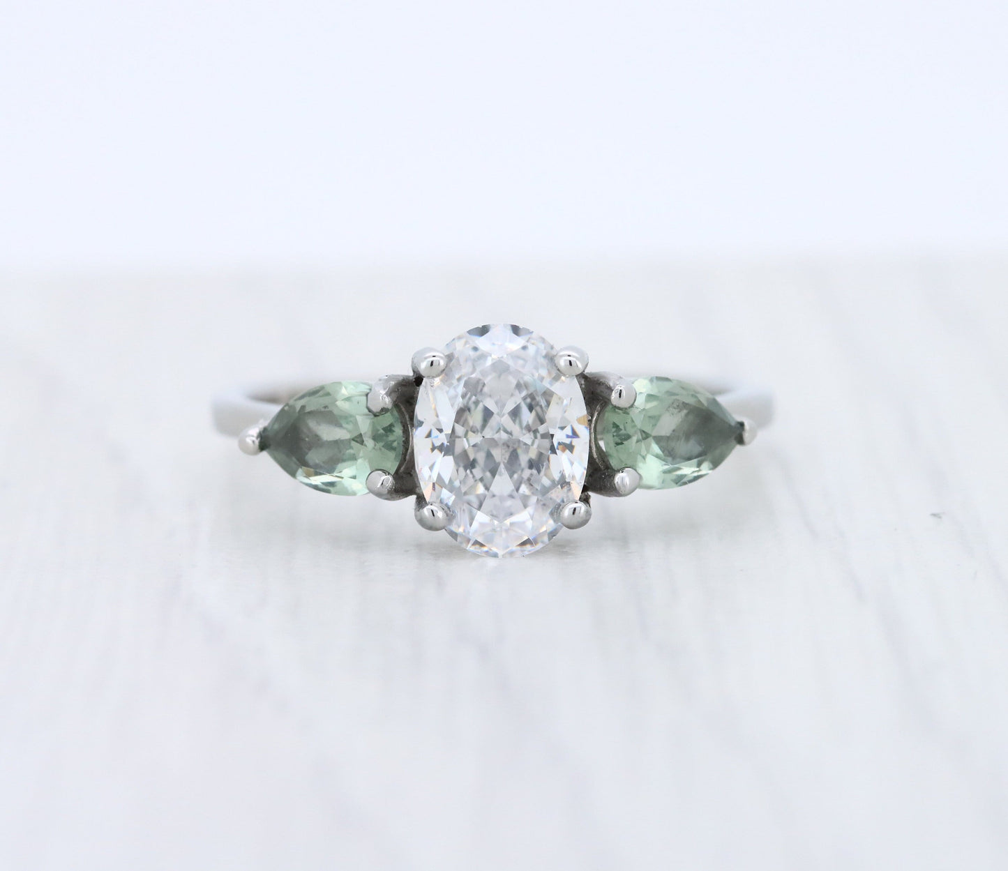 Green Sapphire and White Genuine moissanite Oval & pear cut 3 stone Trilogy Ring in White Gold or Titanium