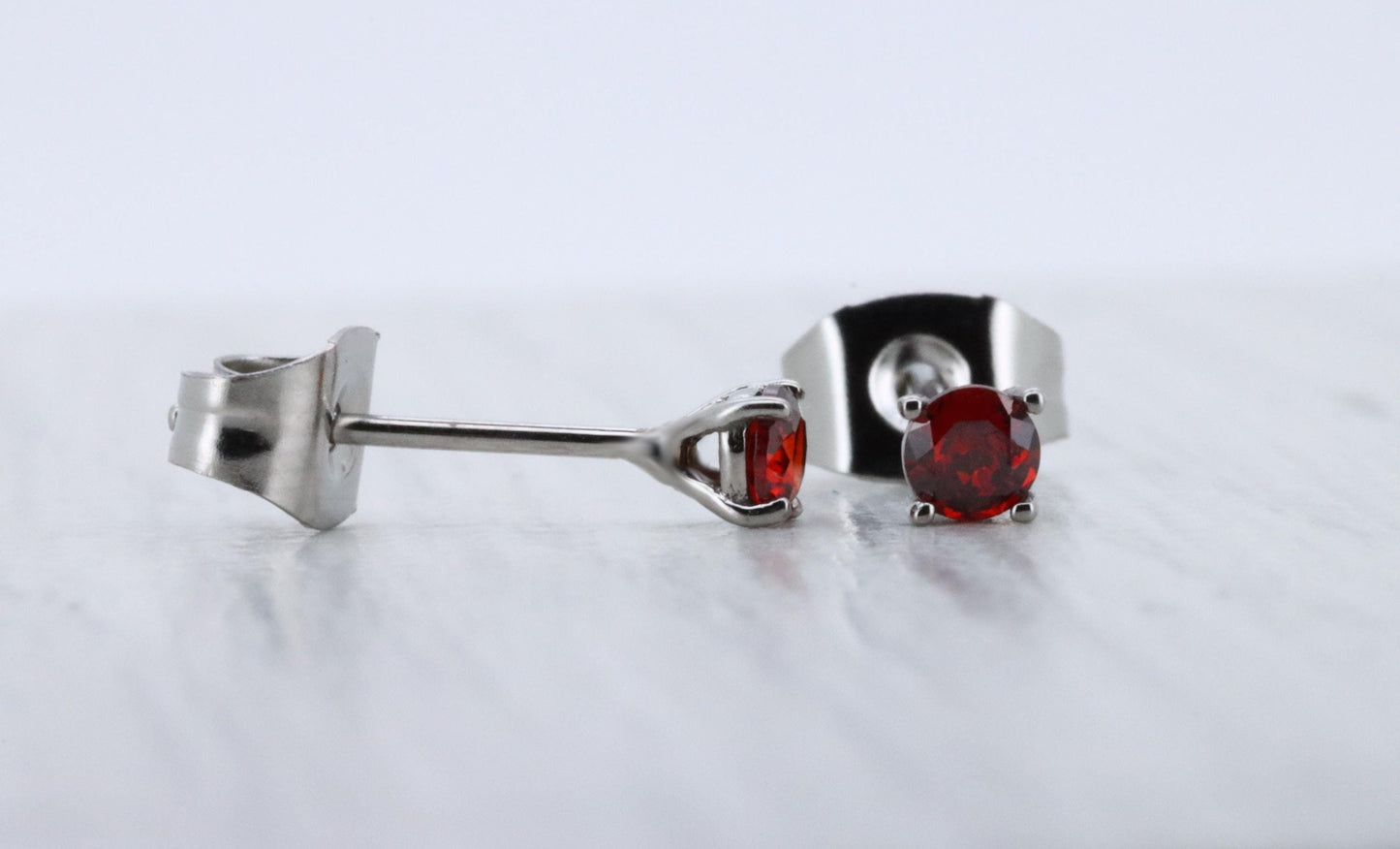 3mm Natural Garnet stud earrings, available in titanium, white gold and surgical steel