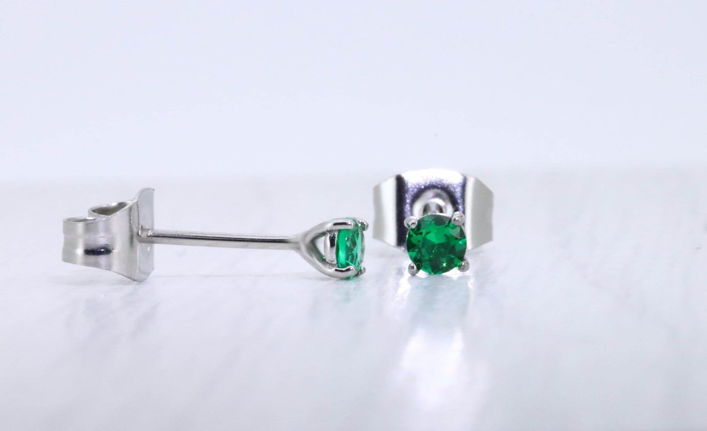 3mm Lab emerald stud earrings, available in titanium, white gold and surgical steel
