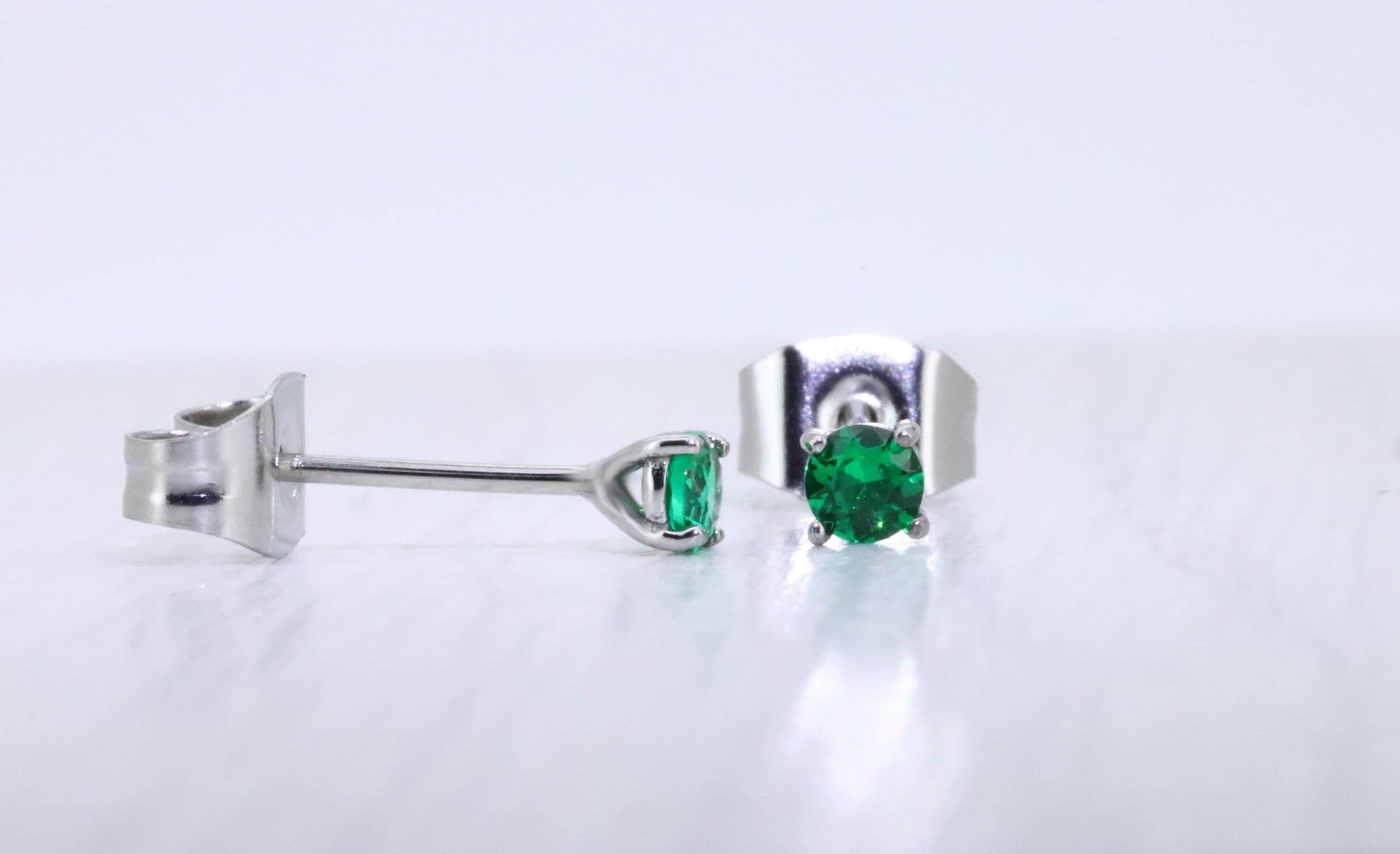 3mm Lab emerald stud earrings, available in titanium, white gold and surgical steel