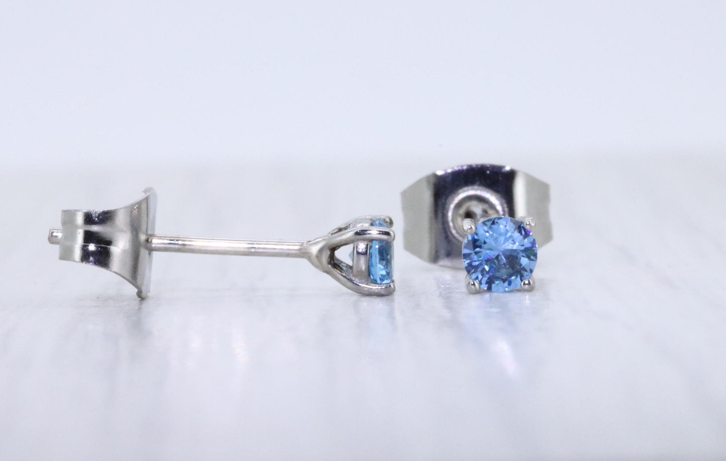 3mm Natural aquamarine stud earrings, available in titanium, white gold and surgical steel