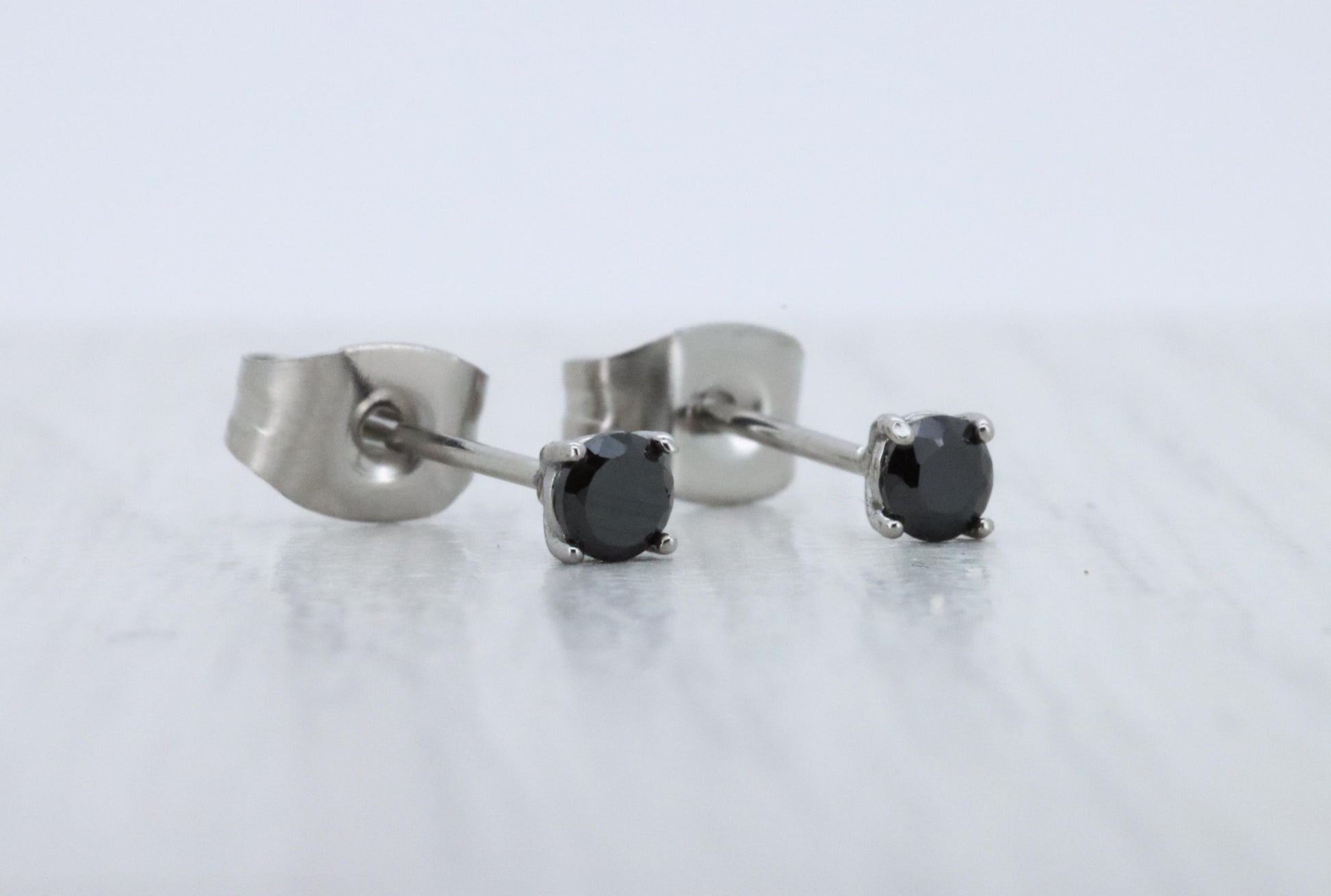 3mm Natural Onyx stud earrings, available in titanium, white gold and surgical steel
