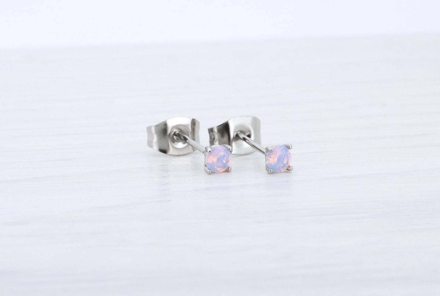 3mm Opal stud earrings, available in titanium, white gold and surgical steel