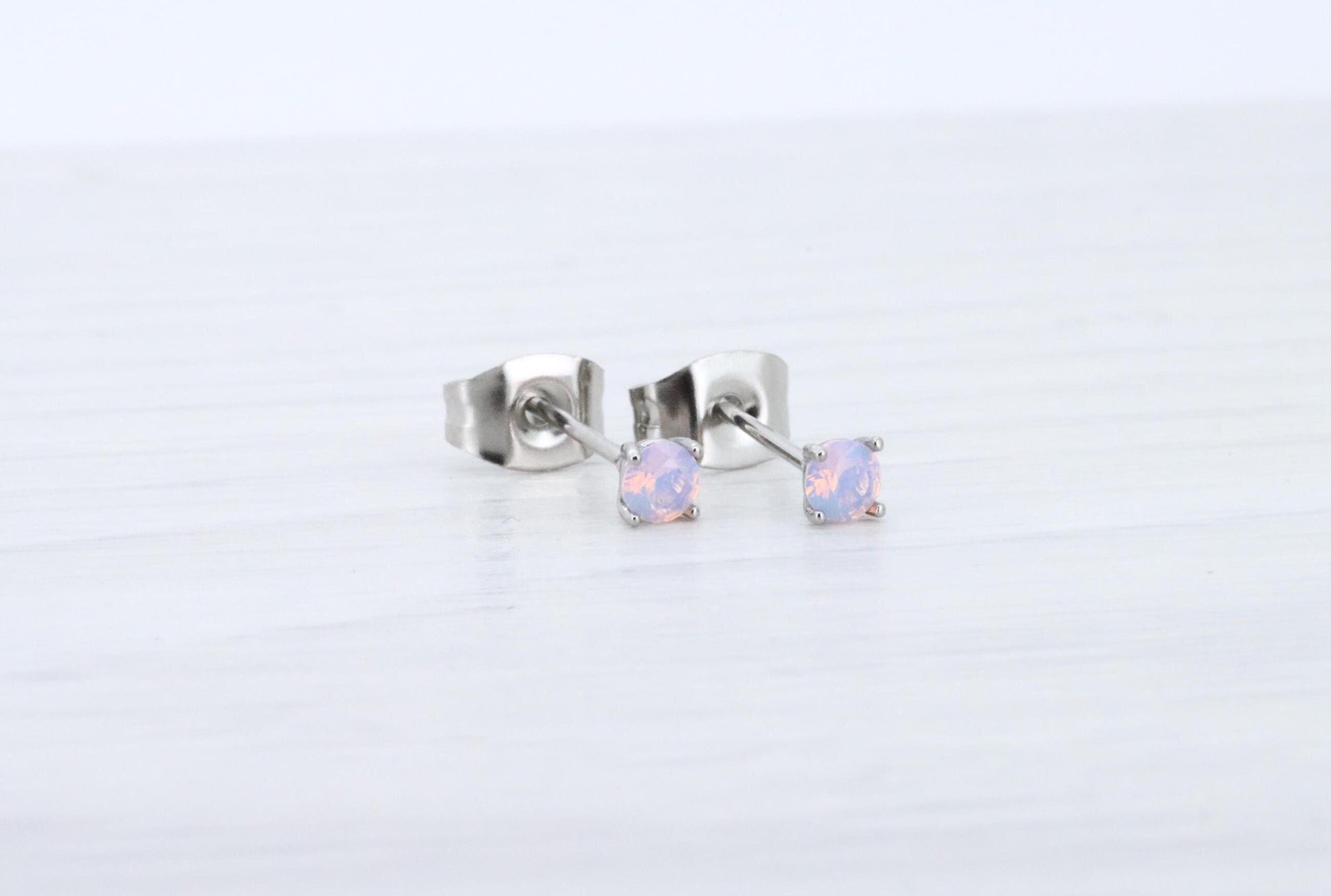 3mm Opal stud earrings, available in titanium, white gold and surgical steel