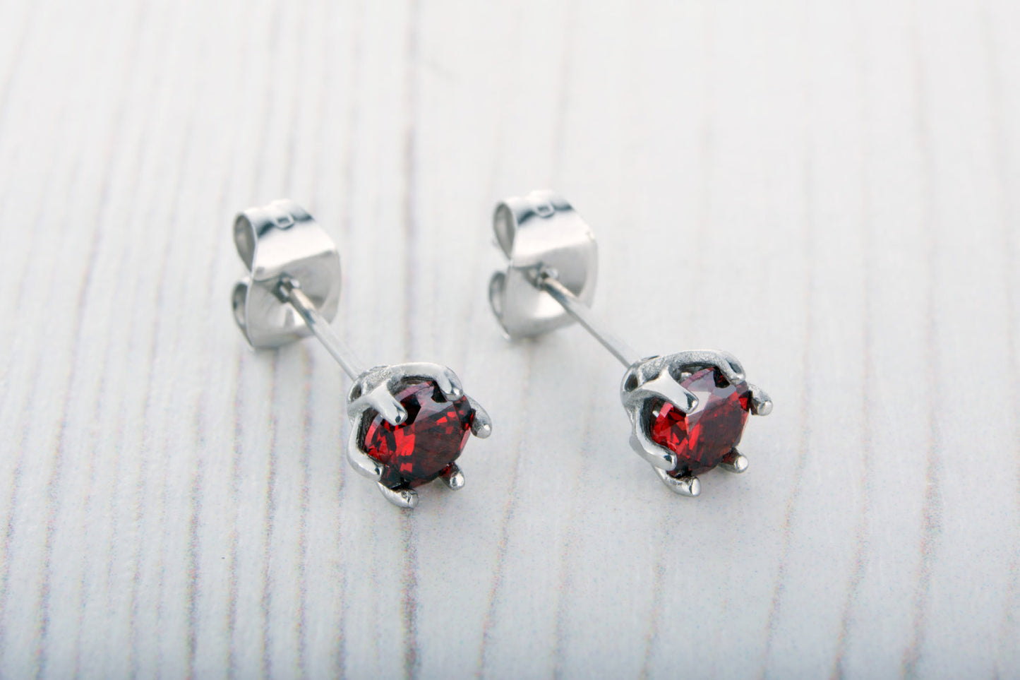 Natural Garnet stud earrings, available in titanium, white gold and surgical steel 4mm & 5mm sizes