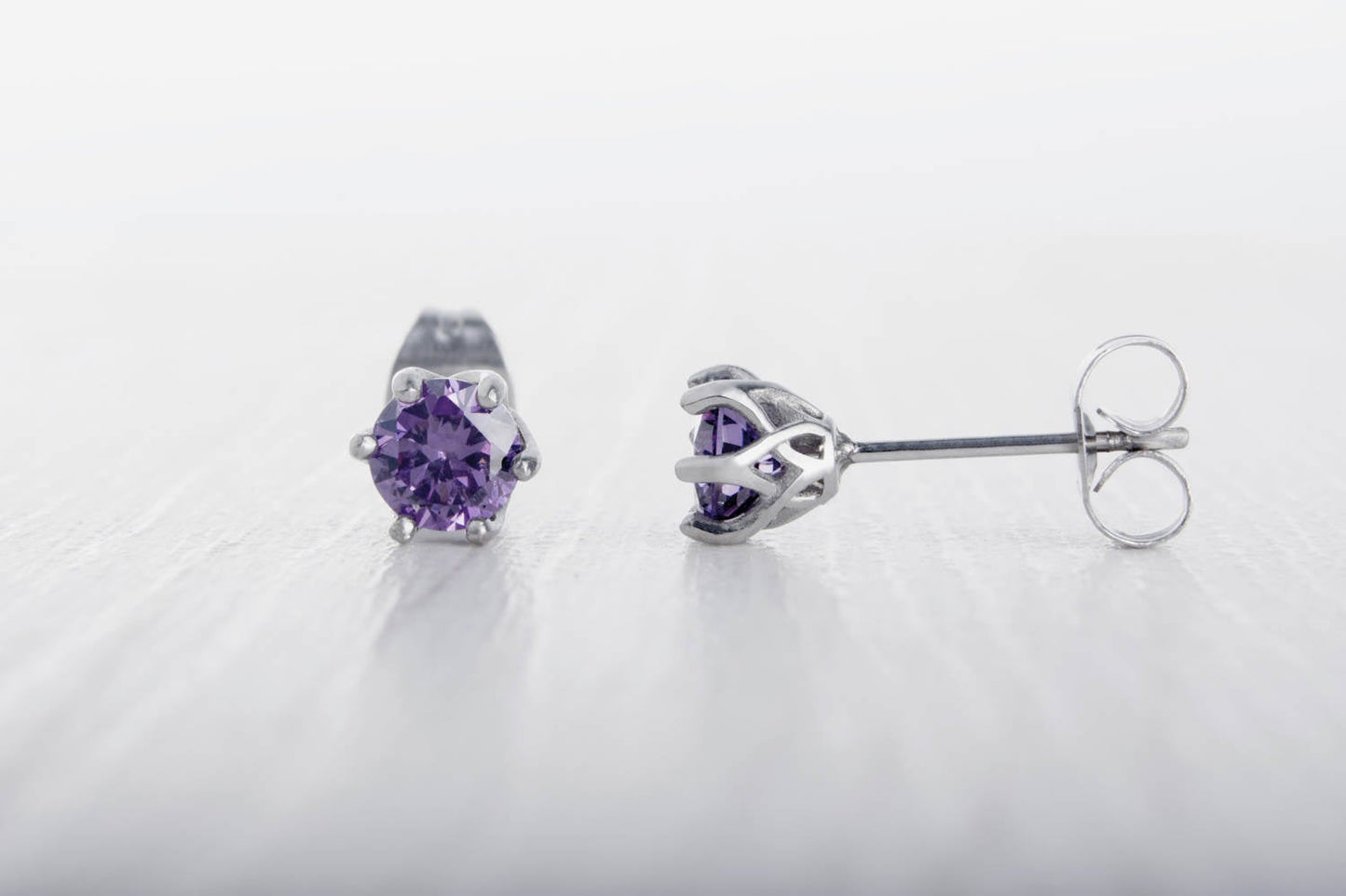 Natural Amethyst stud earrings, available in titanium, white gold and surgical steel 4mm amd 5mm sizes