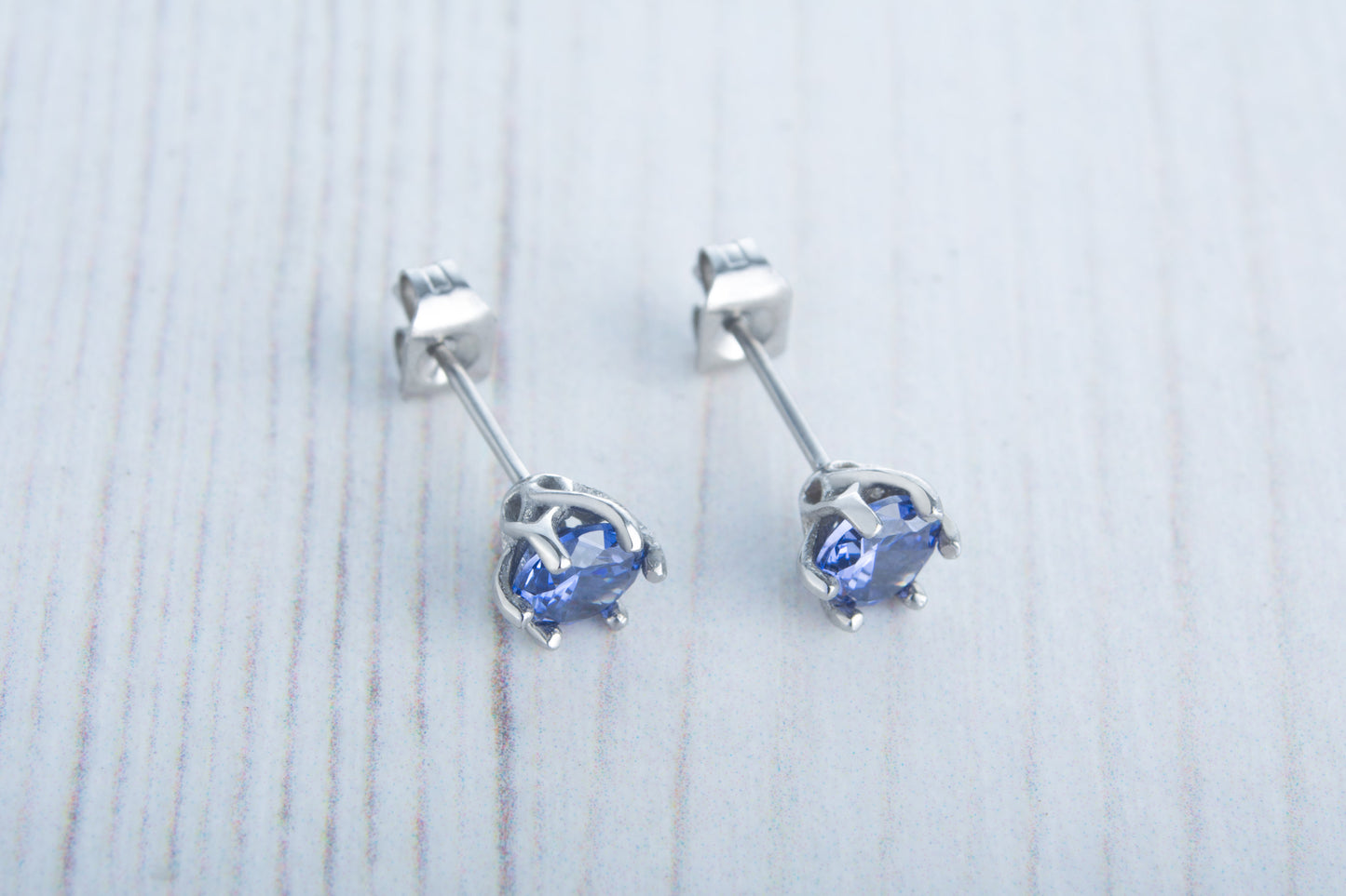 Genuine London Blue Topaz stud earrings, available in titanium, white gold and surgical steel 4mm, 5mm, 6mm sizes
