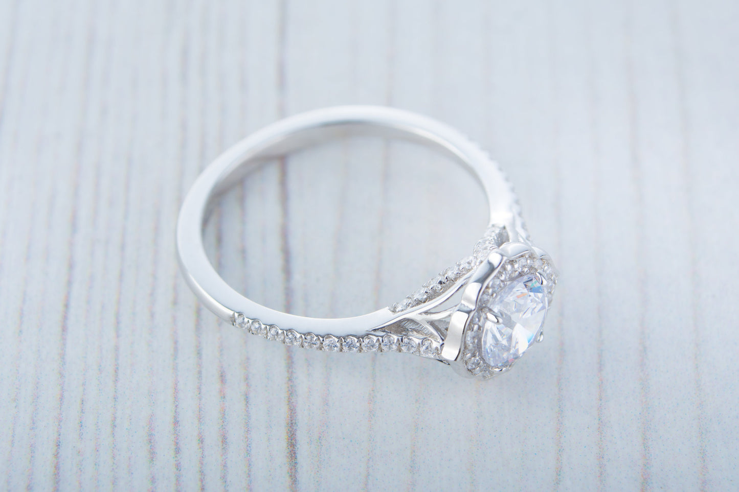 Man made diamond halo solitaire engagement ring available in Sterling Silver or White Gold Filled