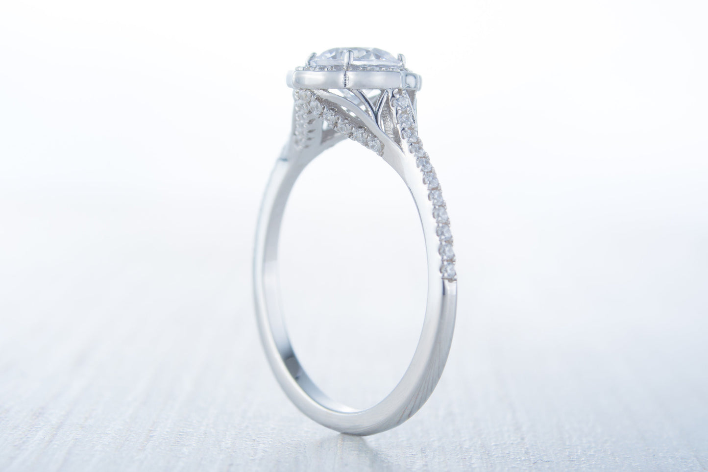 Man made diamond halo solitaire engagement ring available in Sterling Silver or White Gold Filled