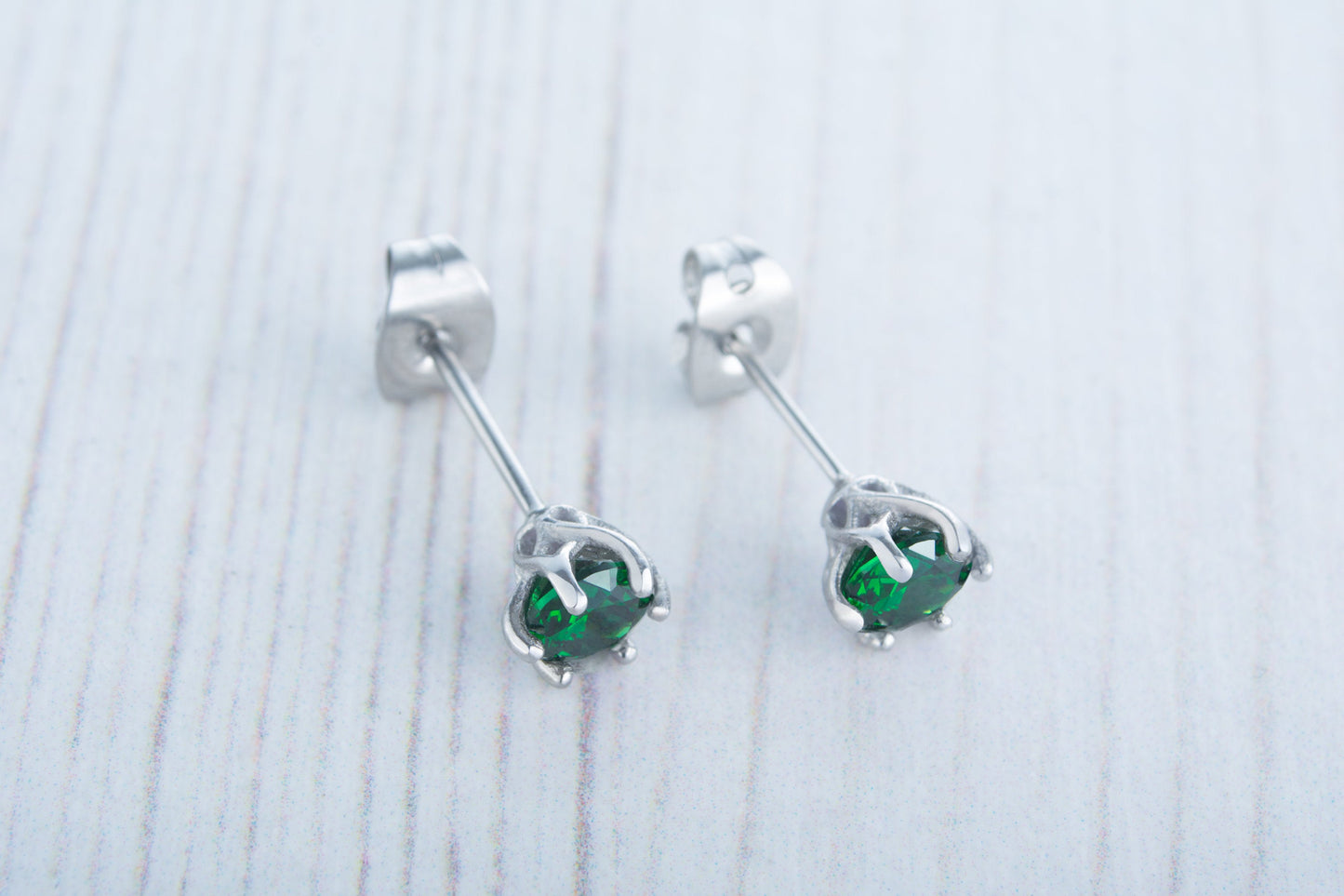 Lab emerald stud earrings, available in titanium, white gold and surgical steel 4mm, 5mm or 6mm sizes