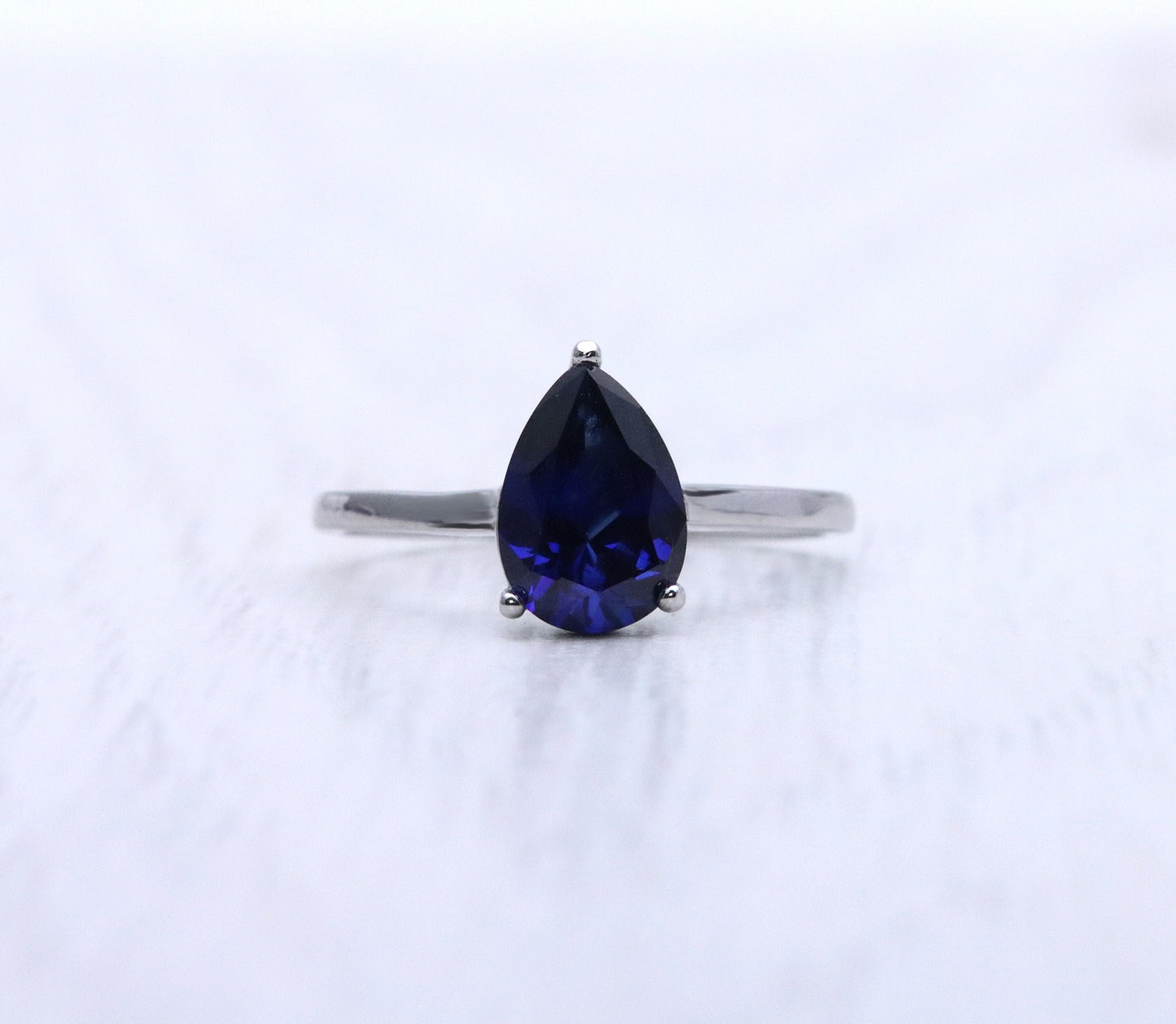 1.7ct Pear Cut Lab Blue Sapphire Solitaire cathedral ring in Titanium or White Gold