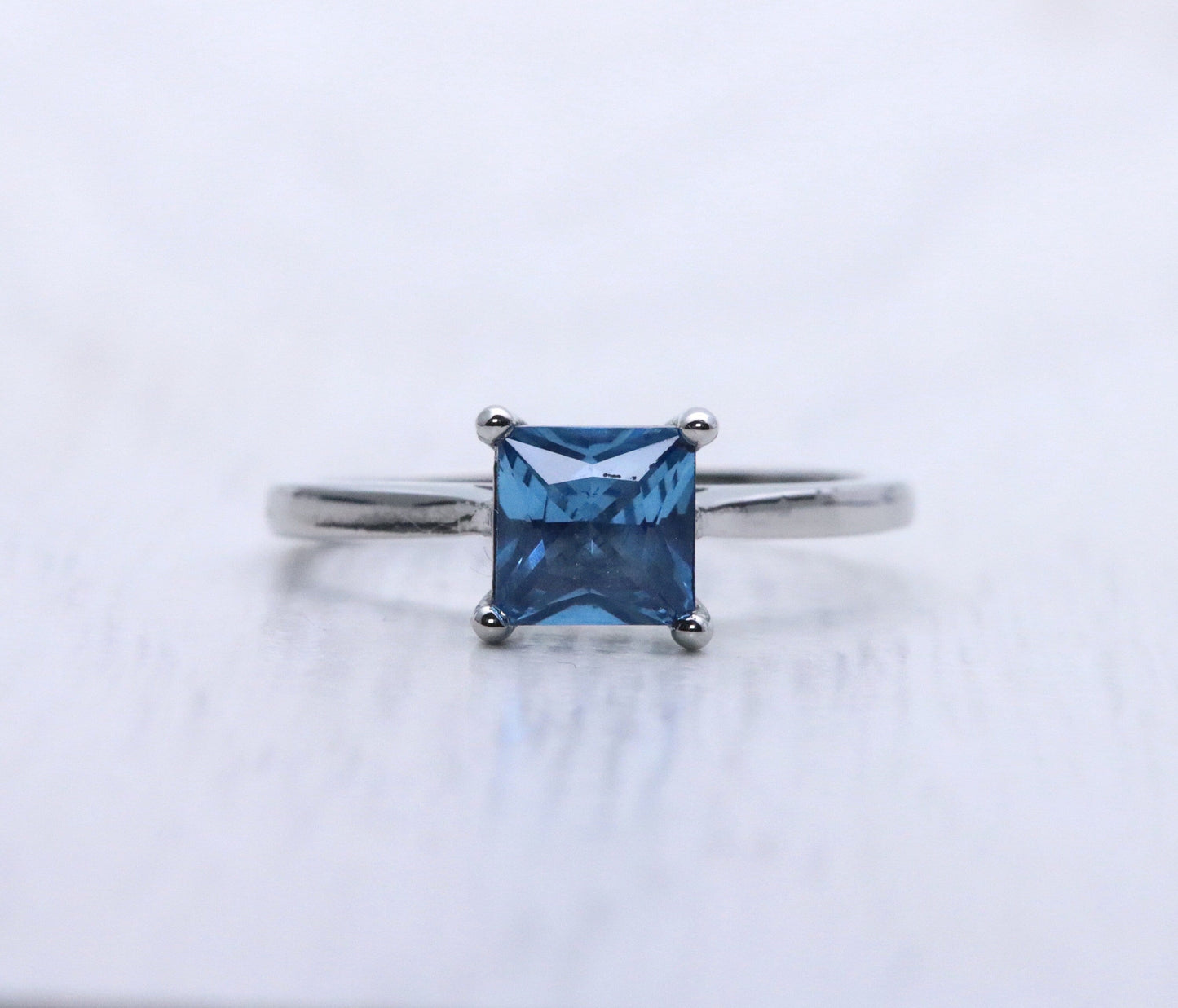 1ct Princess Cut natural blue topaz Solitaire cathedral ring in Titanium or White Gold