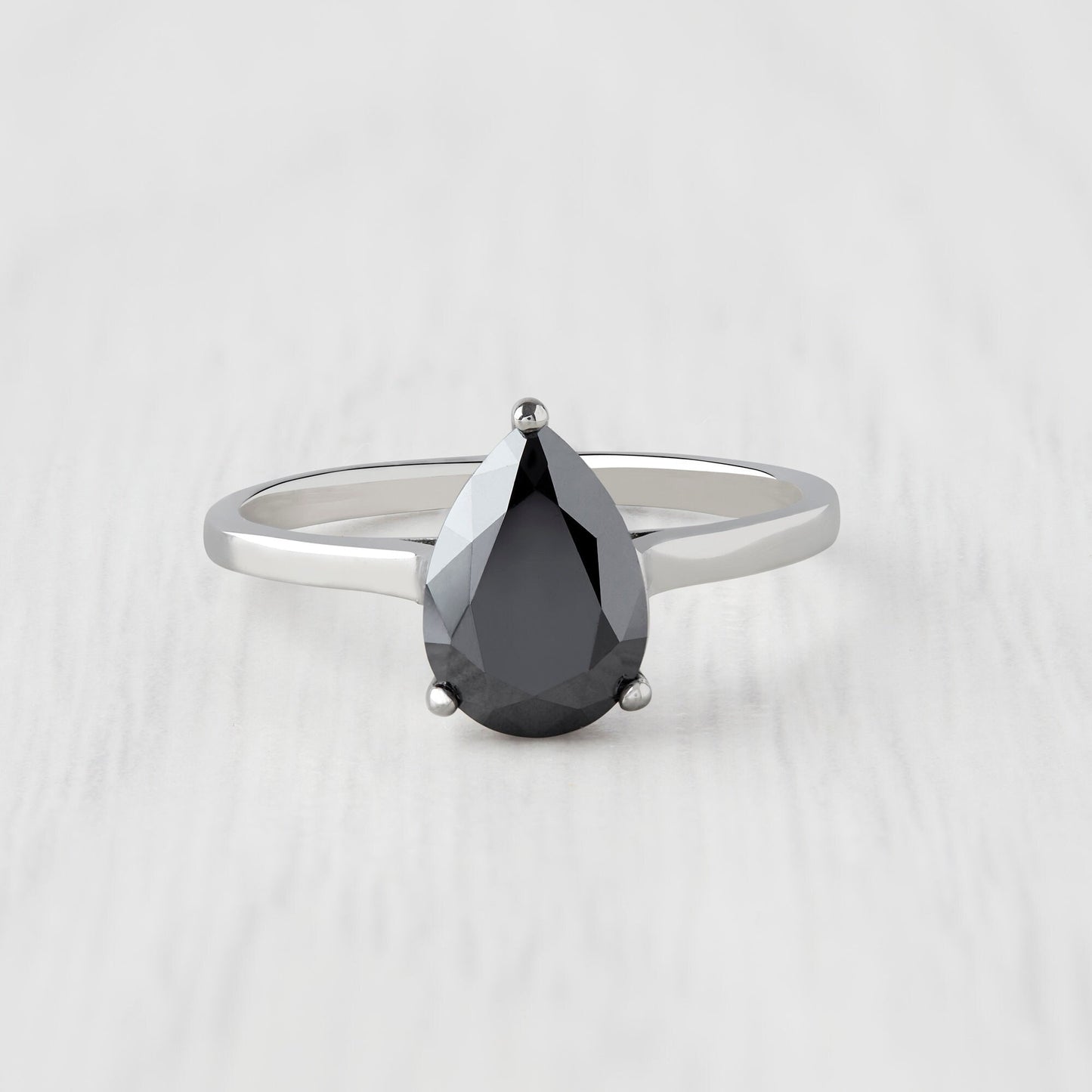 0.7 to 1.7ct Pear Cut Black Moissanite Solitaire cathedral in Titanium or White Gold