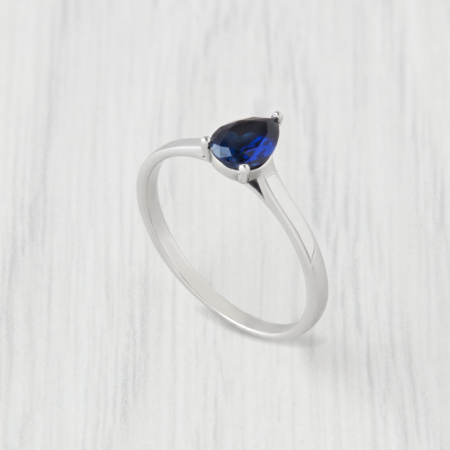 0.7ct Pear Cut Lab Blue Sapphire Solitaire cathedral ring in Titanium or White Gold