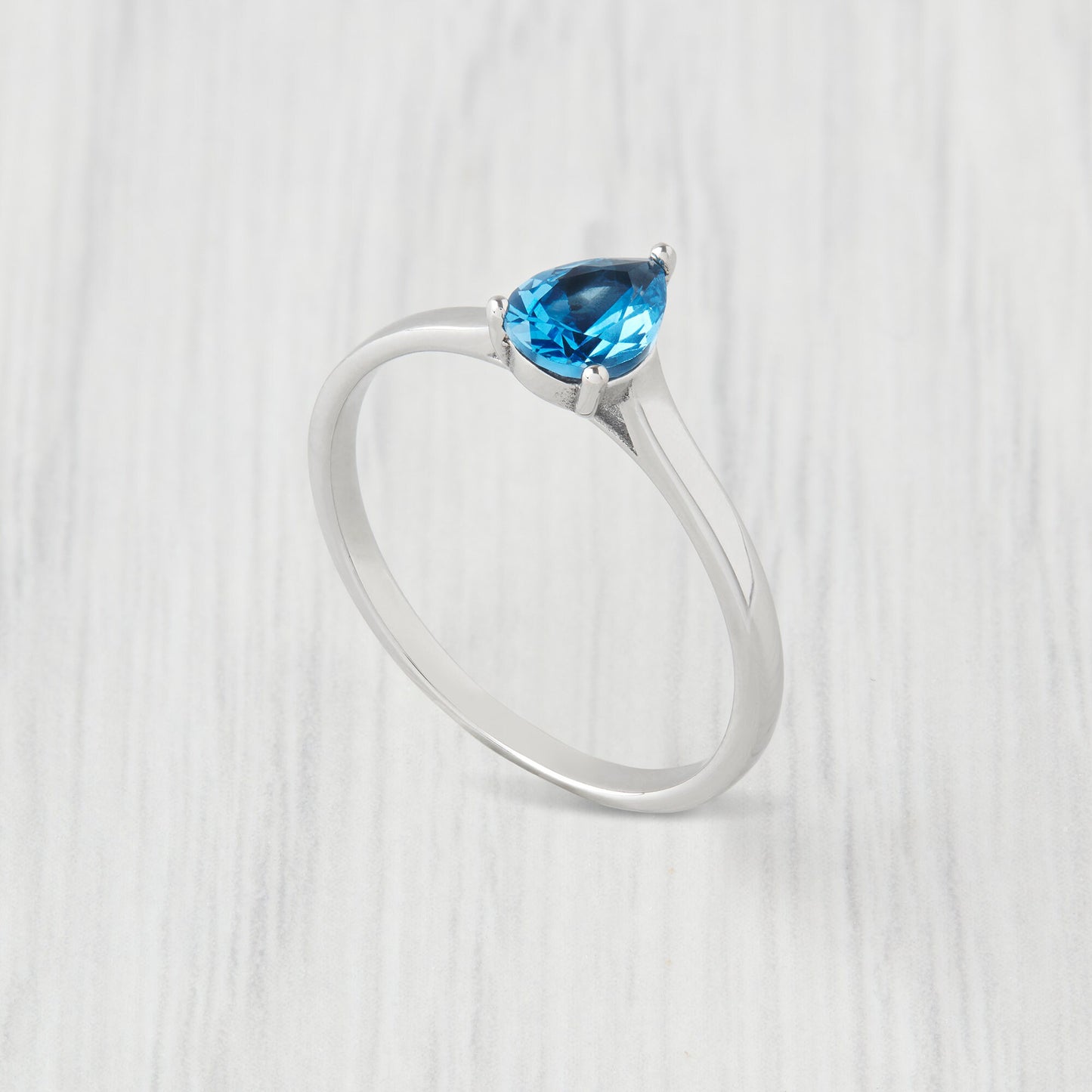0.7ct Oval Cut natural blue topaz Solitaire cathedral ring in Titanium or White Gold