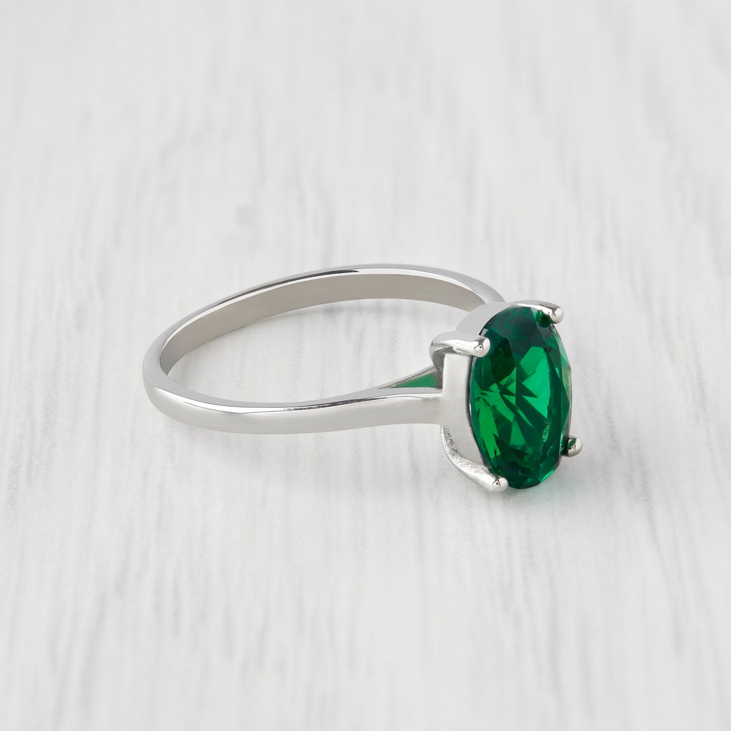 0.7 to 1.7ct Oval Cut lab Emerald Solitaire cathedral in Titanium or White Gold