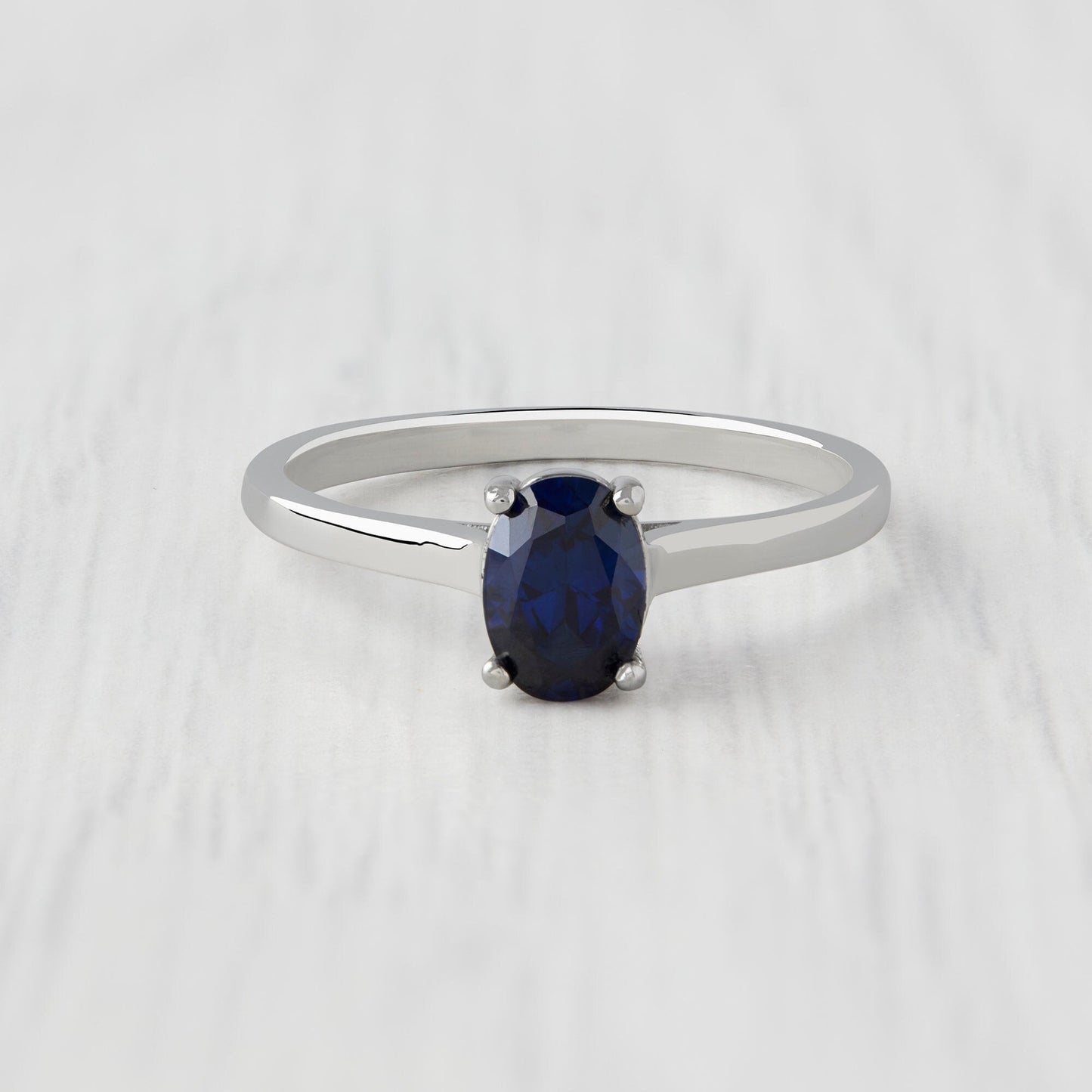 0.7ct Oval Cut Lab Blue Sapphire Solitaire cathedral ring in Titanium or White Gold