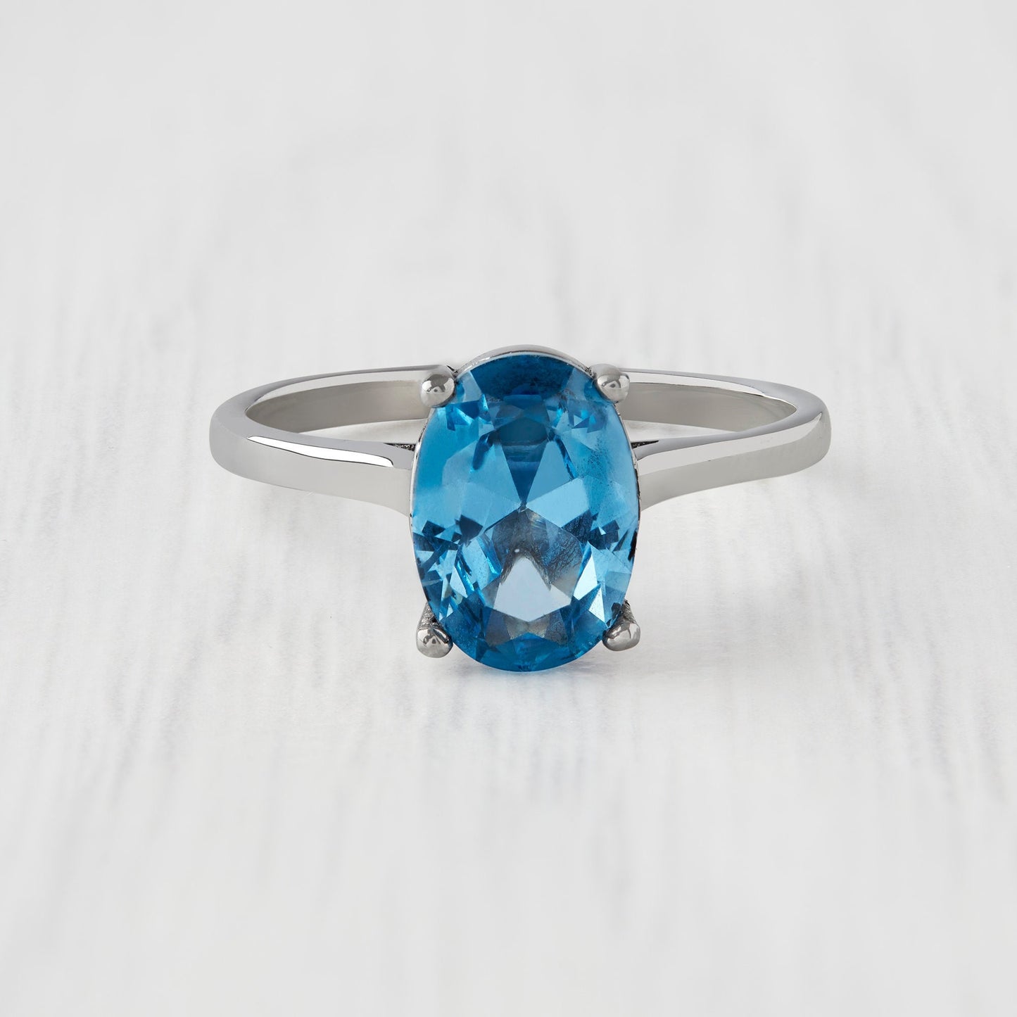 1.7ct Oval Cut natural blue topaz Solitaire cathedral ring in Titanium or White Gold